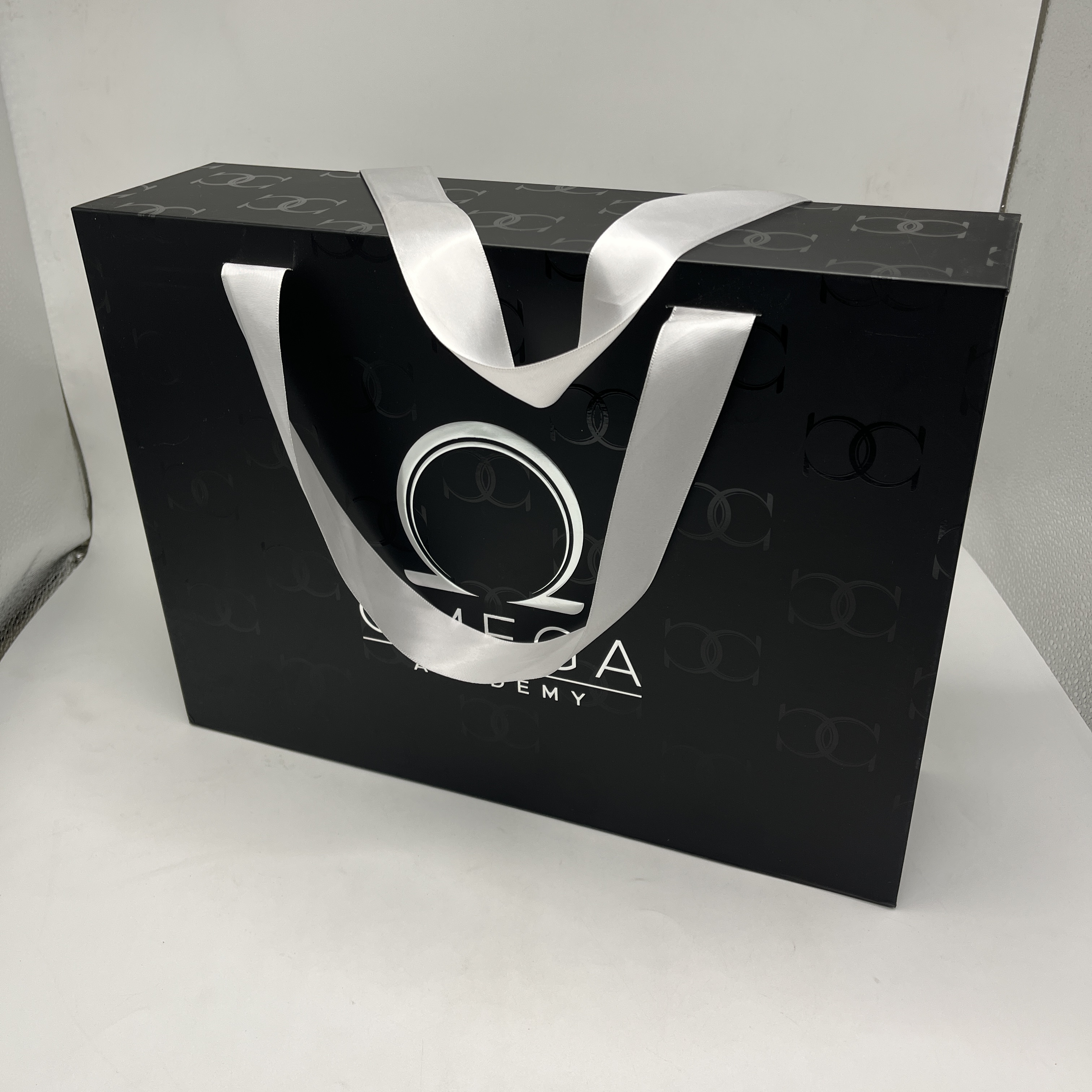 OMEGA Watch Packaging Box | Folding Box with Ribbon Handle Logo